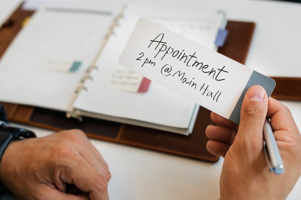 Business Man Holding Appointment Note Concept